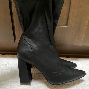 Black pointed boots.